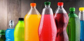 Assorted colorful plastic beverage bottles with condensation