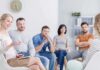 Support group meeting with six adults seated in a circle