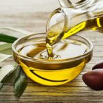 Olive Oil Trick Stuns Blood Sugar Olive oil pouring into a glass bowl