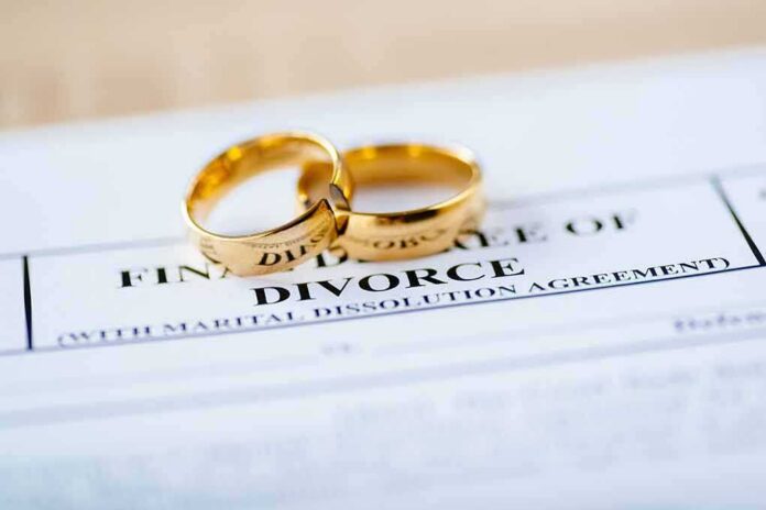 Gold wedding rings on a divorce document