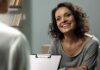 Smiling woman talking during a meeting
