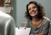 Havard Warning: Pleasure Trap Is Wrecking Happiness Smiling woman talking during a meeting
