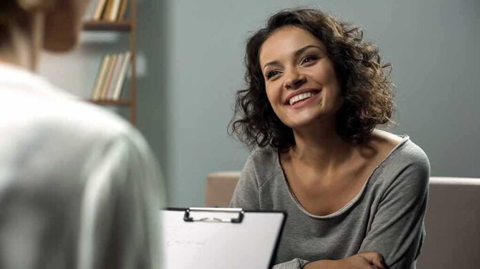 Smiling woman talking during a meeting