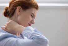 Kitchen Spice Eases Soreness – Real Science Backs It Woman holding her neck in pain