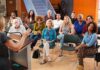 Audience listening to a speaker at a community meeting