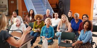 Audience listening to a speaker at a community meeting