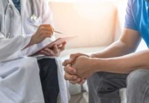 FDA Drops Prostate Cancer Game-Changer Doctor consulting a patient on a sofa