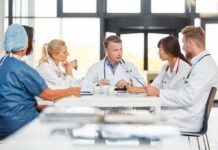 Stop the Creatine Breaks? Experts Push Back Doctors in a meeting at a hospital conference table