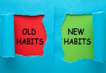 Torn blue paper revealing old habits and new habits text