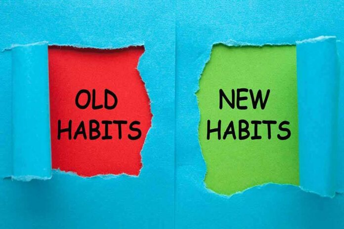shutterstock_1570449355 Torn blue paper revealing old habits and new habits text