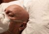 Deadliest Cancers Exposed – The Brutal Two Elderly man wearing a face mask resting on a pillow