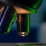 microscope objective lenses with green light in a lab