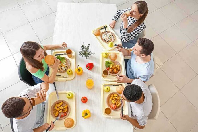 Group of friends eating lunch at a cafeteria table