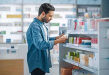 Man shopping in a pharmacy aisle