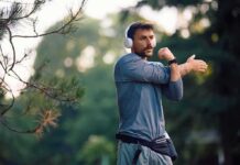 Morning Walks, Surprising Fat Switch man stretching his arm outdoors while wearing headphones