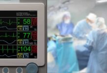 Intestines Melted – Hollywood Star’s Terrifying Close Call patient monitor beside blurred surgeons in an operating room