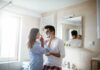 Couple in bathroom applying shaving cream playfully