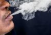 Close-up of a person exhaling smoke