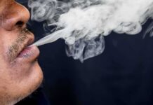 Close-up of a person exhaling smoke