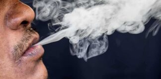 Close-up of a person exhaling smoke